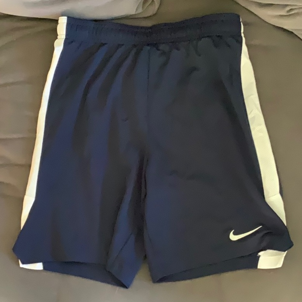 Three pairs of Nike Dri-fit athletic soccer shorts